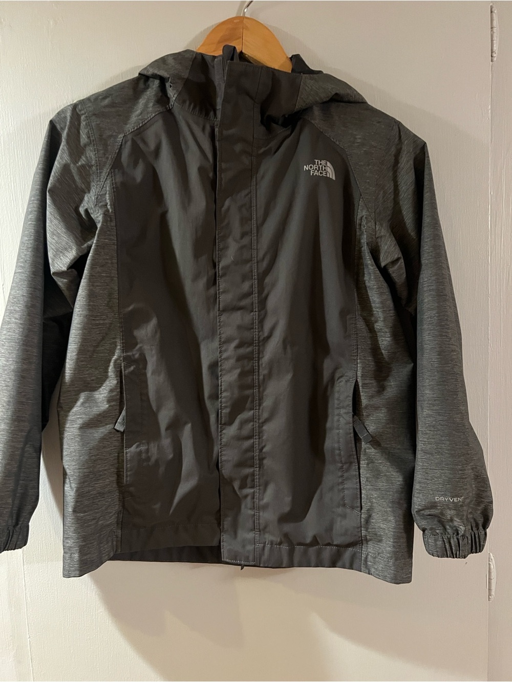 The North Face Boy’s Gray Hooded Rain Jacket
Size M, 10/12